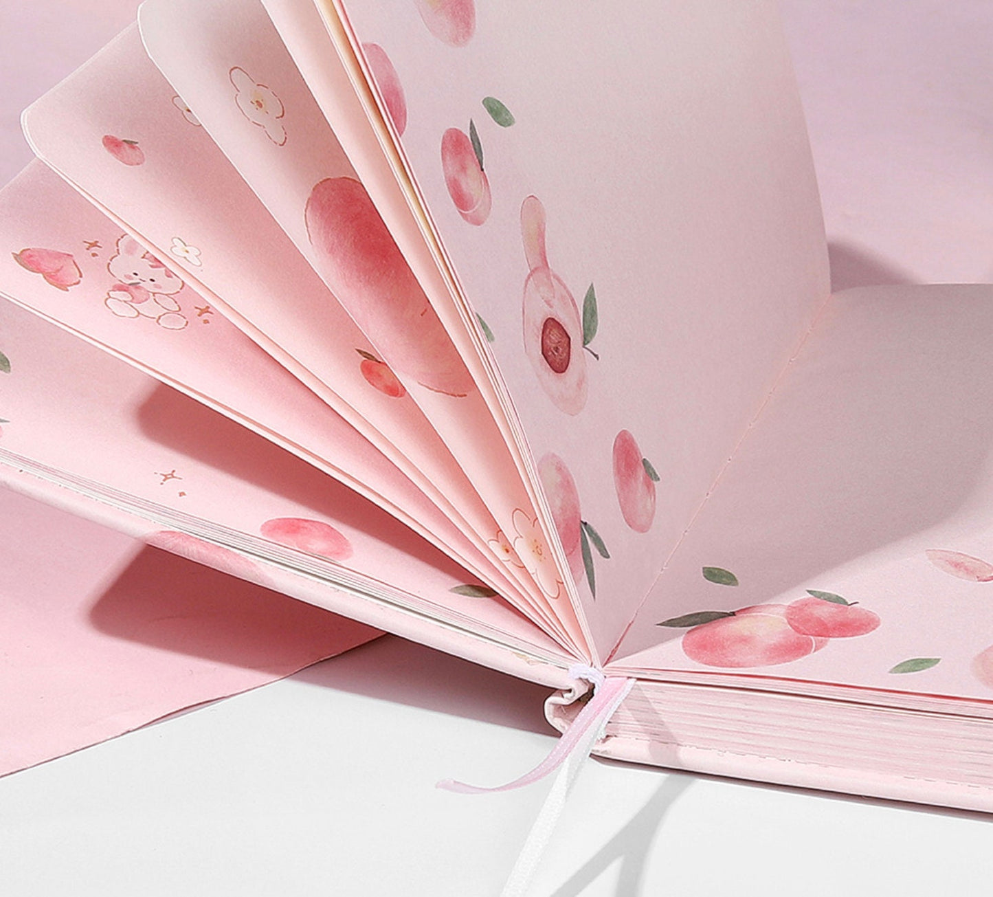 Peach Pink Magnetic Buckle Journal Gift Set with cute peach and floral designs on pink pages, perfect for kawaii stationery enthusiasts.