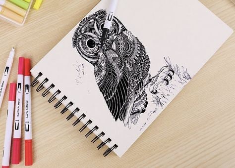 Dual tip brush markers in use drawing an intricate owl design in a sketchbook, showcasing the versatility and precision of the 36 colors set, ideal for art, coloring, and calligraphy.