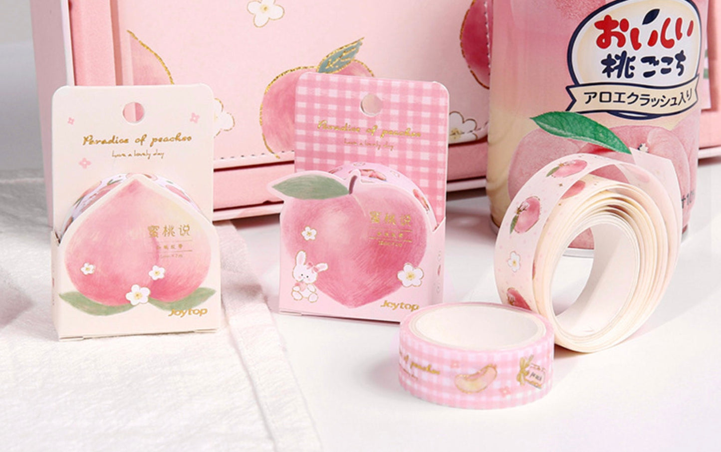 Peach Pink Magnetic Buckle Journal Gift Set with adorable peach-themed packaging featuring cute rabbit and floral designs, accompanied by matching washi tapes for decoration. Perfect for journaling and note-taking in kawaii style.