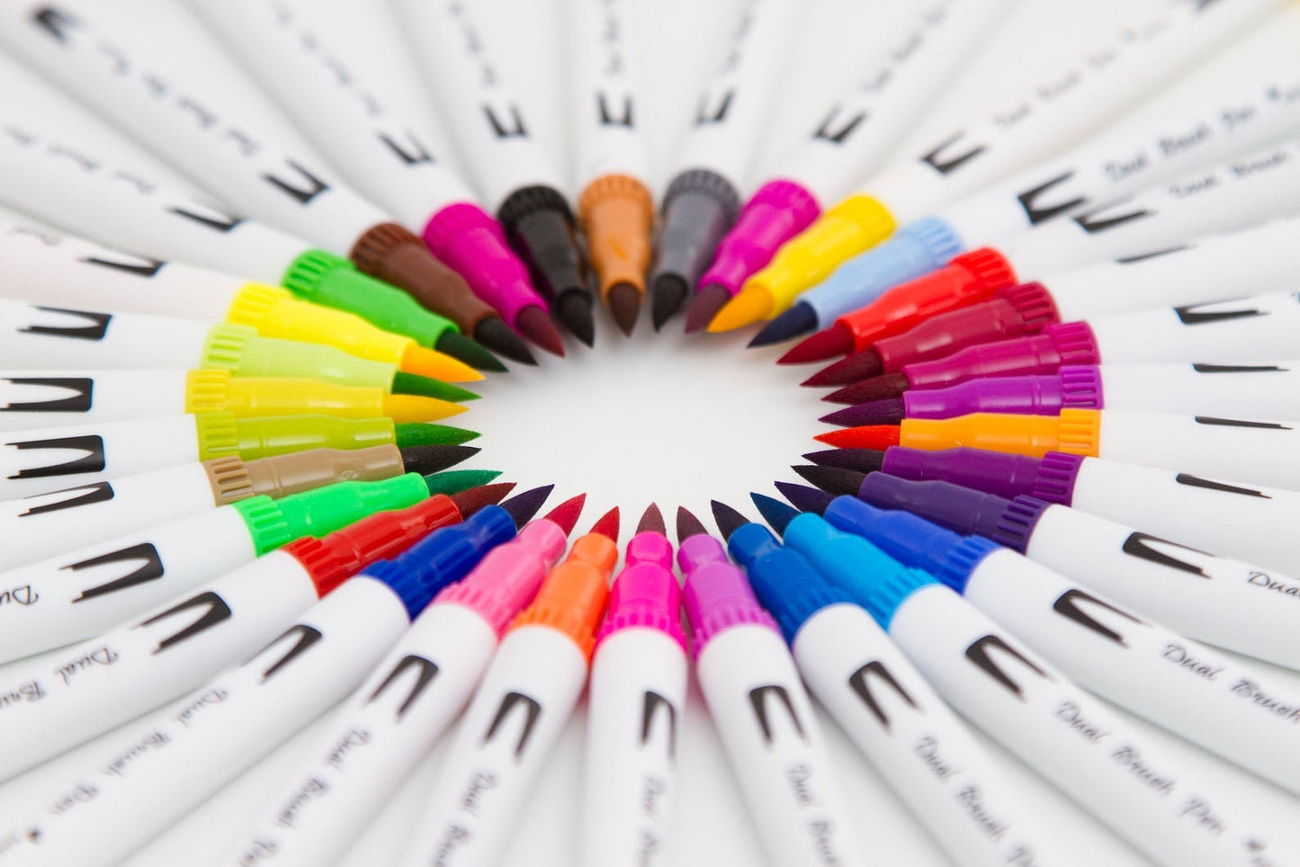 36 Colors Dual Tip Brush Markers Set for Art, vivid color arrangement in a circular pattern, perfect for drawing, coloring, and calligraphy.