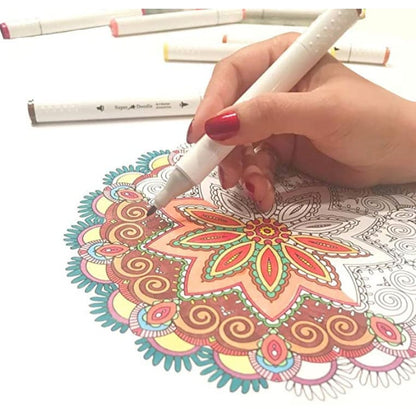 Hand holding a white dual tip alcohol marker coloring a detailed floral mandala design.