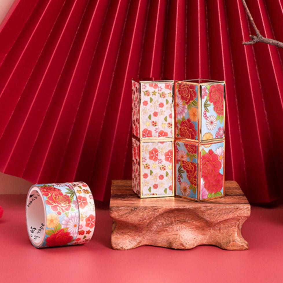 Colorful Flowers Washi Tape Set displayed against a red backdrop, ideal for craft projects and DIY gifts.