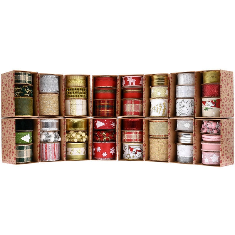 Assorted Christmas ornament ribbons featuring white snowflakes, gold stars, and various holiday designs in red, green, gold, and silver, neatly organized in individual compartments.