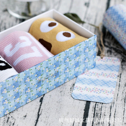 Floral Blue Washi Tape Set - Craft and DIY with Kawaii Patterns in a Decorative Box on a Rustic Surface