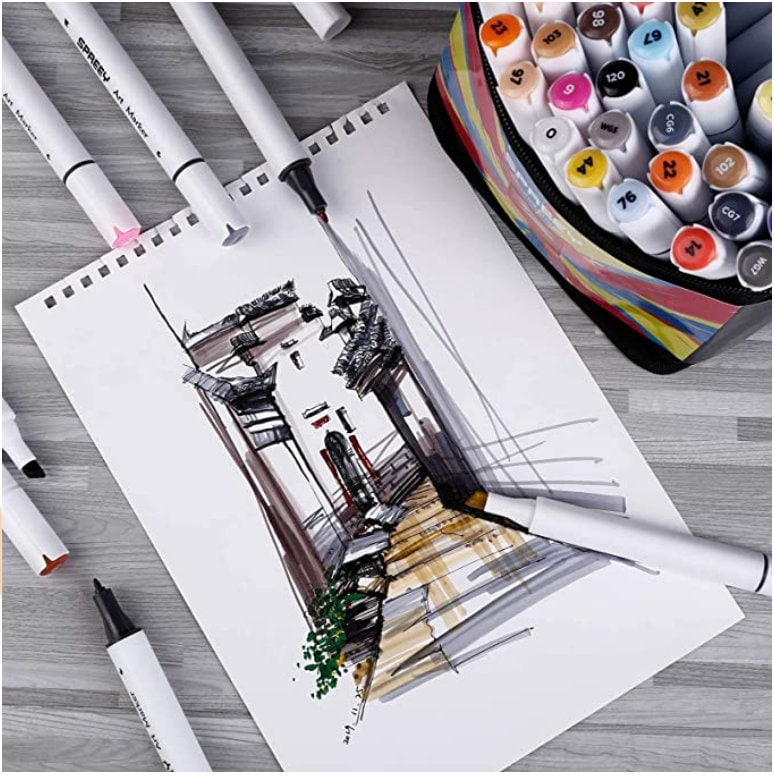 12-Color Dual Tip Alcohol Markers with Case, artistic sketching on paper, various open markers showcasing dual tips, organized in colorful case on wooden surface