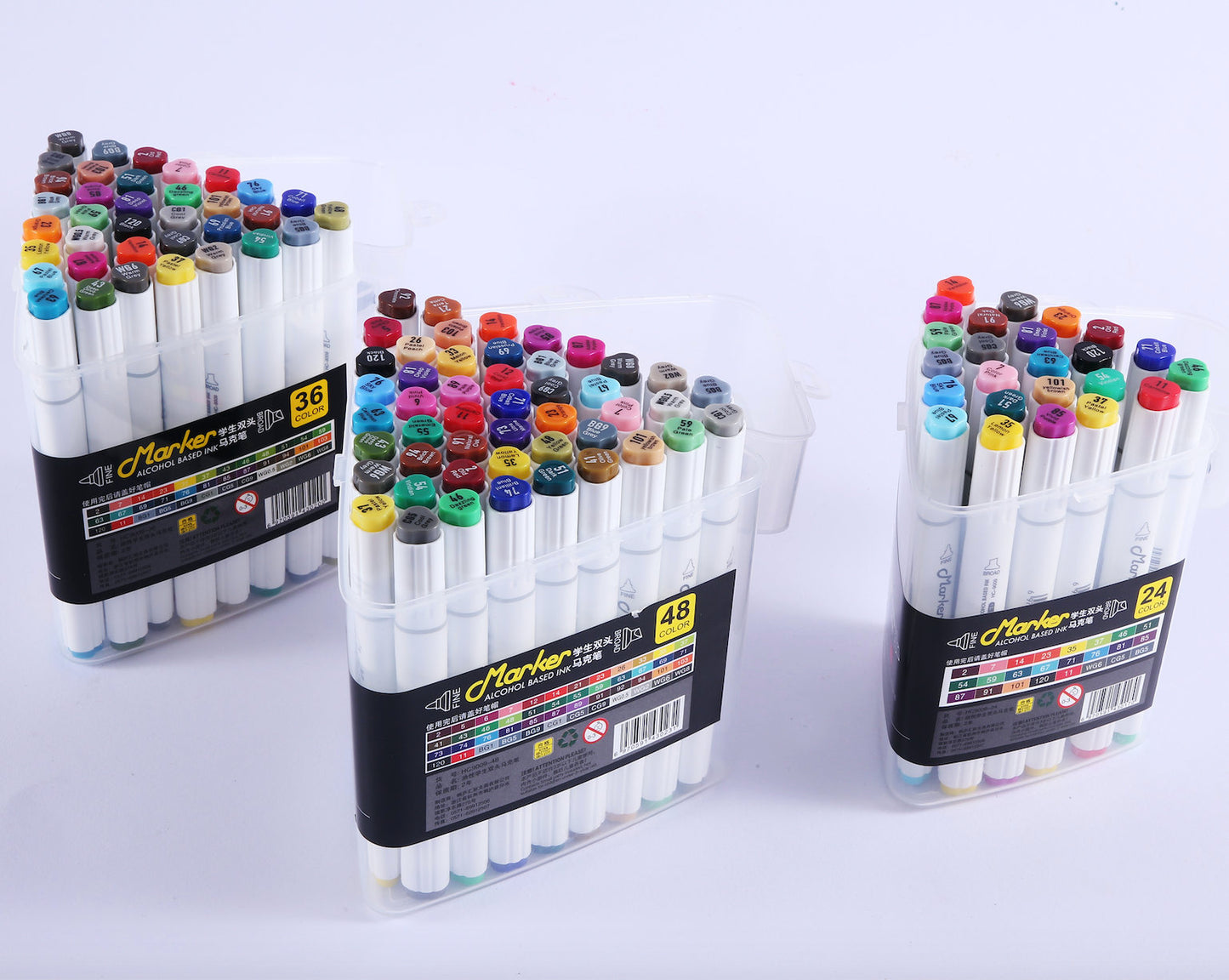 12-Color Dual Tip Alcohol Markers with Case in clear plastic packaging, featuring vivid colors, fine and broad tips, ideal for artists and crafters.