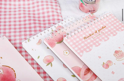 A4 Pink Peach Coil Sketch Book - Cute Planner with peach-themed designs and checkered patterns on a pink gingham background.