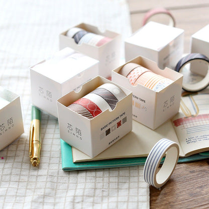 Cute Colorful Washi Tape Set - 5 Rolls in packaging, each roll 5 meters, various patterns displayed on table with stationery items.