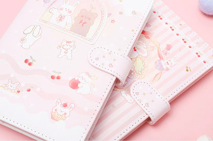 Sweet Cherry Leather Journal A5 Planner with Magnetic Buckle featuring kawaii bunny and bear illustrations in pastel pink and white colors.