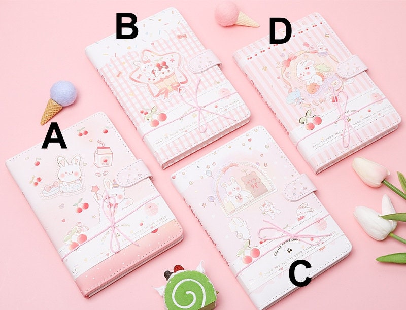 Sweet Cherry Leather Journal - Magnetic Buckle A5 Planner in four designs (A, B, C, D) with kawaii bunny and cherry illustrations on a pink background.