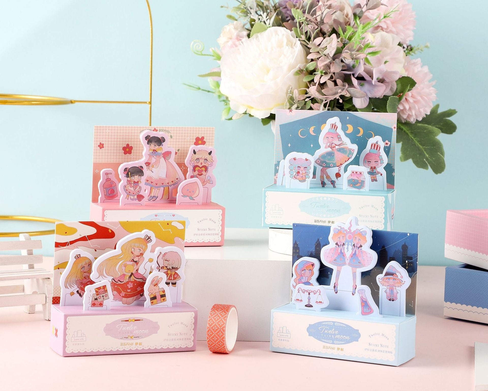 Twelve Moon Sticky Notes & Washi Tape Set with cute kawaii characters and colorful designs, displayed with floral background, perfect for journaling and crafting.