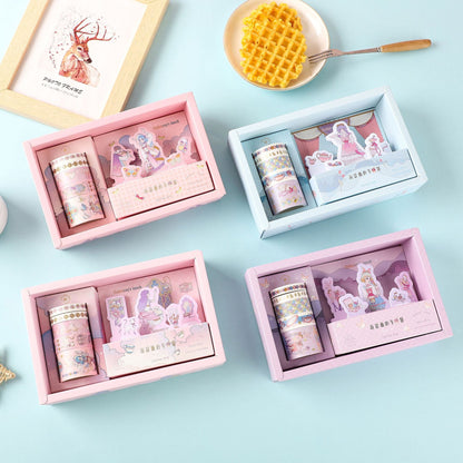 Miss Hathaway's Lunch Sticky Notes & Washi Tape Set in four pastel-colored boxes on a light blue background, featuring kawaii illustrations and delicate designs. 