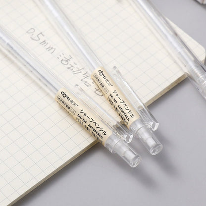 0.5mm transparent mechanical pencils on grid notebook - ideal for office and student stationery needs.