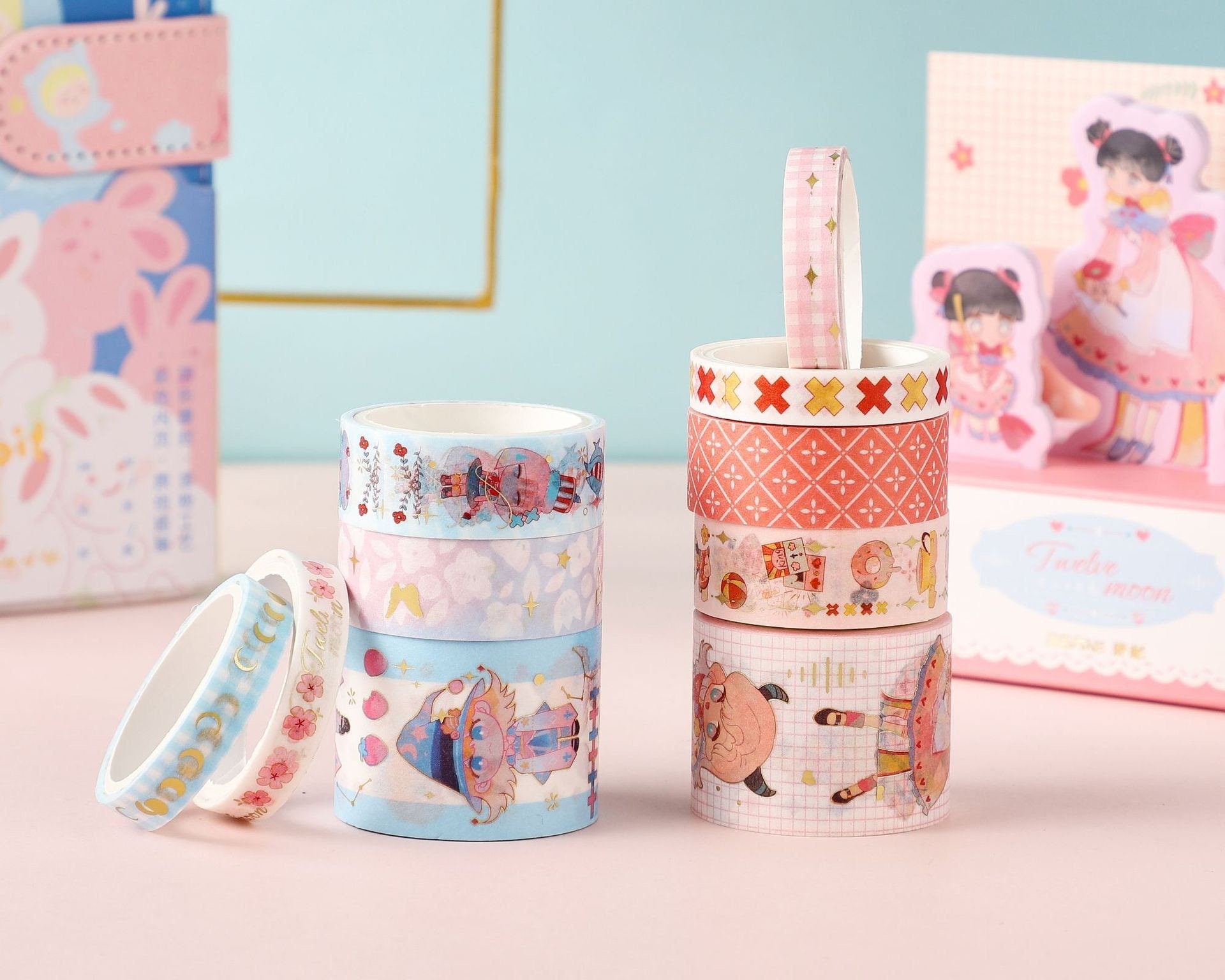 Twelve Moon Sticky Notes & Washi Tape Set featuring colorful and kawaii-themed designs, including bunnies, moons, and characters in pastel hues, perfect for journaling and crafts.