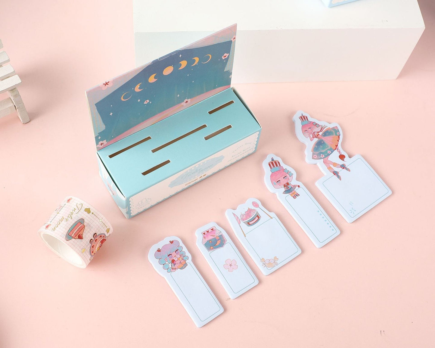 Twelve Moon Sticky Notes & Washi Tape Set featuring pastel-colored washi tape and cute character sticky notes in various designs, displayed with a moon phase theme packaging.