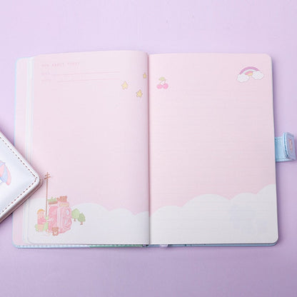 Cute Pink Leather Animal Town Journal - A5 Magnetic, open to show pink pages with kawaii animal town illustrations, stars, cherries, and a rainbow, perfect for note-taking and journaling.