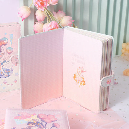 Fantasia in F Minor Journal with leather cover and bookmark, featuring cute pink illustrations and a secure strap closure, perfect for kawaii stationery enthusiasts.