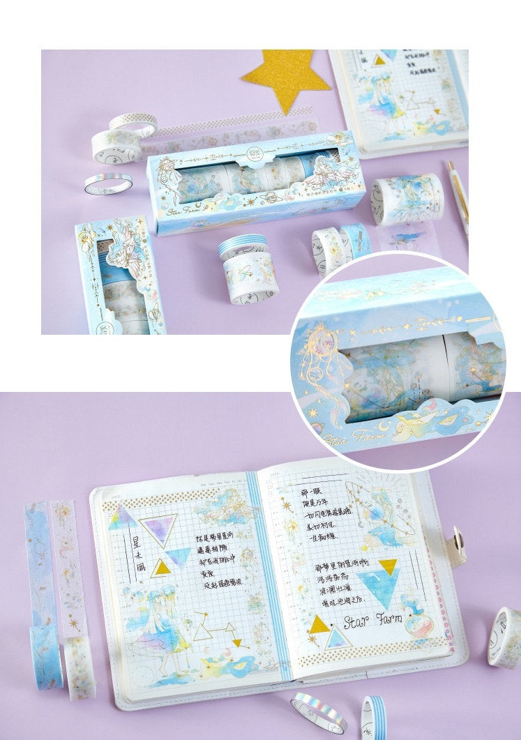 Mercury World Washi Tape Set - 8 Rolls, featuring beautifully illustrated pastel designs in shades of blue, purple, and white, displayed alongside an open journal with aesthetic decorations and notes on a lavender background. Perfect for scrapbooking and journaling enthusiasts.