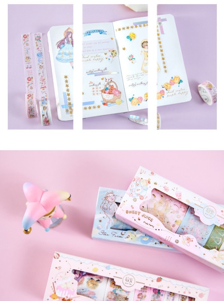 Mercury World Washi Tape Set - 8 Rolls displayed with a kawaii bullet journal, featuring various pastel and floral designs on washi tapes, set against a pink background.