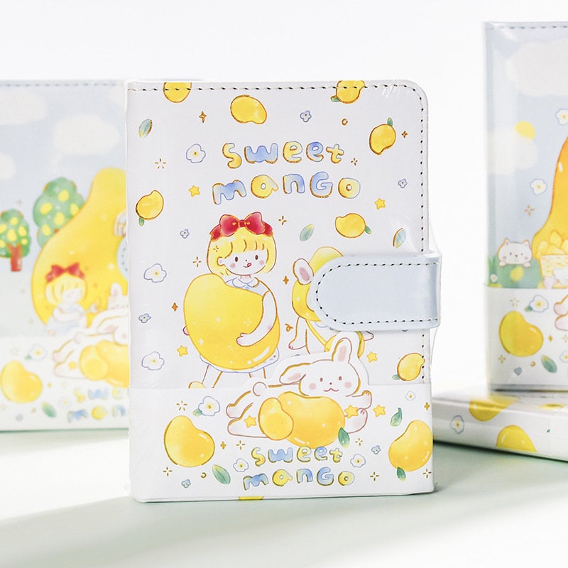 Magnetic Buckle Leather Planner with Lemon Girl Design, featuring kawaii illustrations of a girl and bunny with yellow fruits, "Sweet Mango" text, perfect for cute stationery lovers.