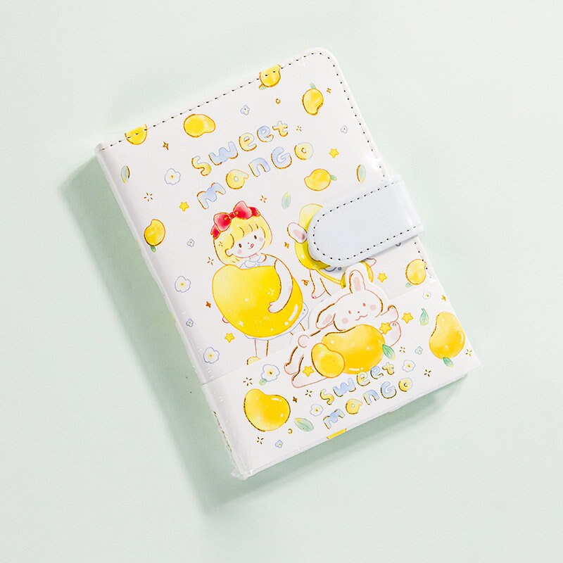 Magnetic Buckle Leather Planner with Lemon Girl Design, featuring cute kawaii illustrations of a girl and bunny holding mangoes, "sweet mango" text, and secure magnetic clasp.