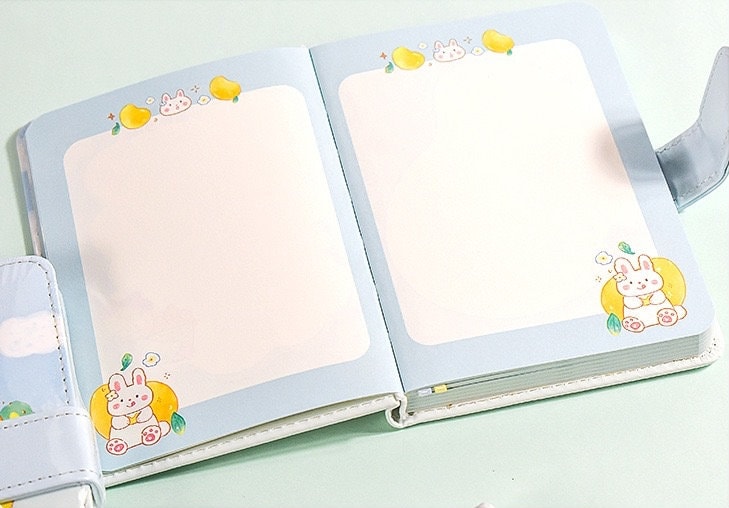 Magnetic Buckle Leather Planner - Lemon Girl Design open to two pages with cute kawaii bunny and lemon illustrations on a pastel background.