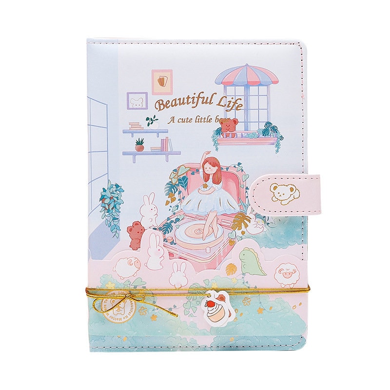 Cute pink leather A5 journal featuring an adorable animal town design with magnetic closure.