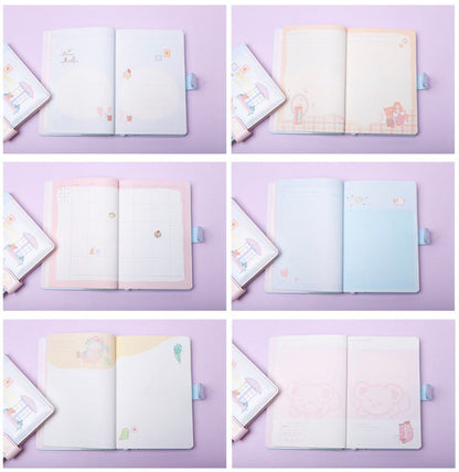 Cute Pink Leather Animal Town Journal - A5 Magnetic; kawaii-style journal with pastel pink and blue pages featuring adorable animal illustrations and motifs; includes a magnetic closure; ideal for note-taking, planning, and drawing; perfect gift for stationery lovers; features various page designs for creativity.