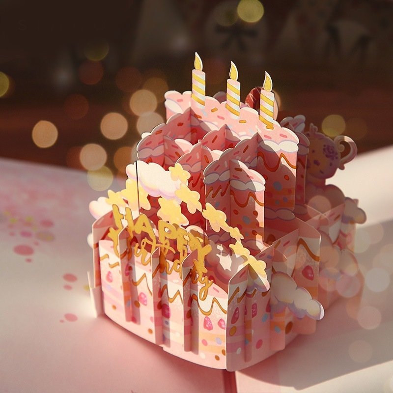 3D Pink Cake Pop Up Card - Happy Birthday with intricate design featuring three candles on a layered cake and "Happy Birthday" text, perfect for kawaii stationery and celebration.