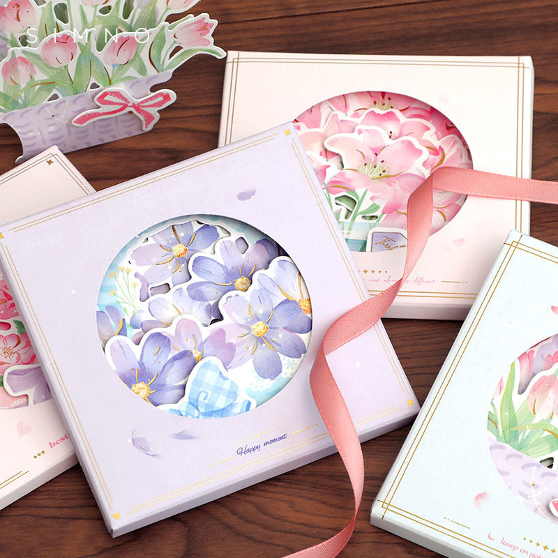 3D Pink Flower Pop-Up Greeting Card - Rose & Lily with intricate designs featuring roses and lilies, presented in pastel-colored packaging with ribbon accents. Perfect for special occasions and as a unique gift.