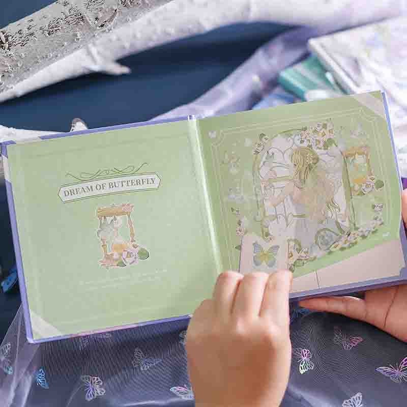 Dream of Butterfly Hardcover Notebook with Bookmark being opened, showing the detailed and whimsical butterfly and fairy-themed design on the inside pages.