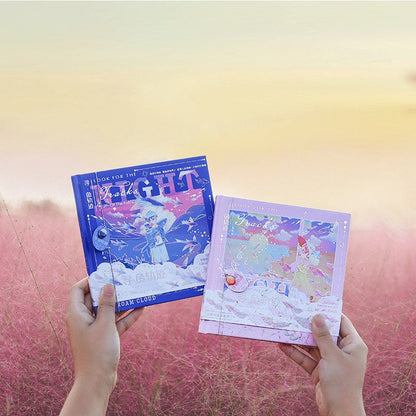 Two hands holding Fish Hear Sea Hard Cover Journals with Bookmarks, one in vibrant blue and the other in pastel pink, featuring whimsical sea-themed artwork on covers.