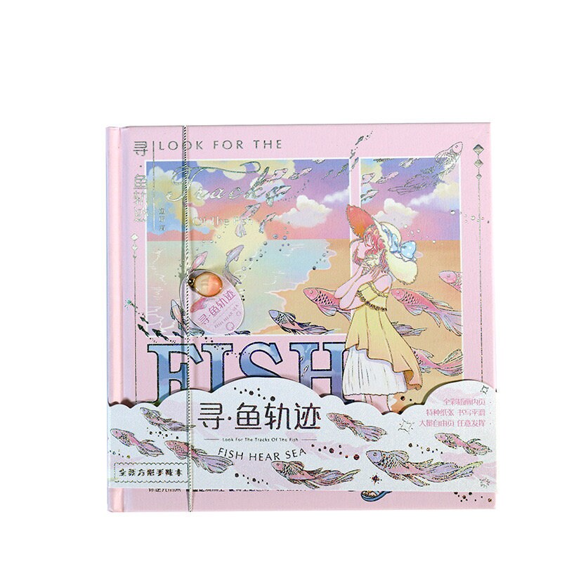 Fish Hear Sea Hard Cover Journal with Bookmark in pastel pink, featuring an illustrated girl in a yellow dress and wide-brim hat. The cover art includes fish swimming against a dreamy, cloud-filled sky with a string closure and decorative pearl accent. Kawaii stationery for writing and drawing.