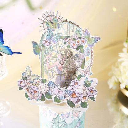 3D flower and butterfly pop-up greeting card featuring intricate cutouts of colorful butterflies, delicate flowers, and a whimsical fairy illustration. Perfect for special occasions and celebrations.