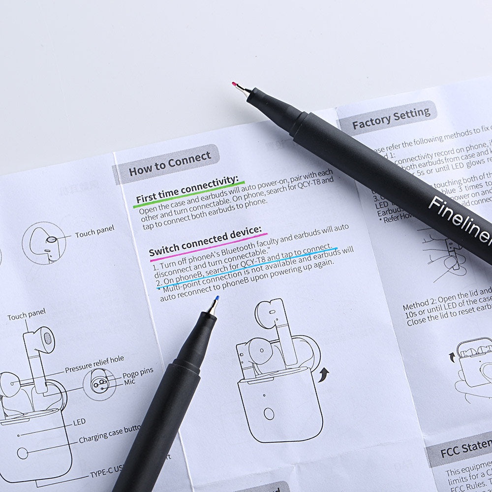 Two black fineliner pens laying on a manual titled "How to Connect", part of the 12-Color Fineliner Pens Set for Journals and Art, ideal for detailed drawing and writing.