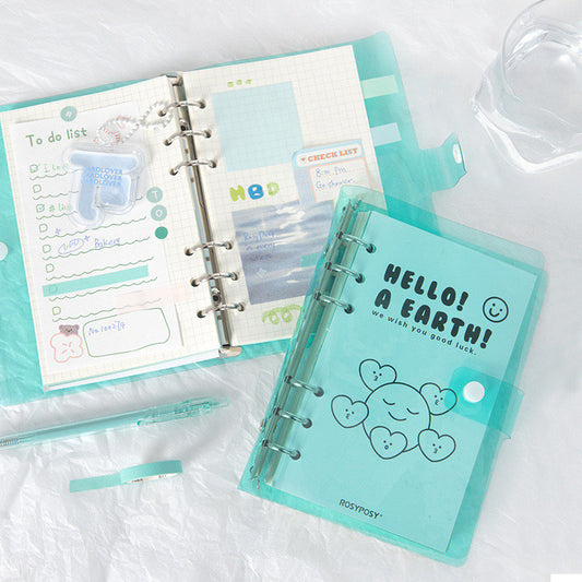 A6 Loose Leaf Planner with Stickers and Cards in teal color displayed on a white surface, includes grid paper, to-do list, customizable pages, cute decorative stickers, and matching pen. Kawaii style stationery for productivity and organization.