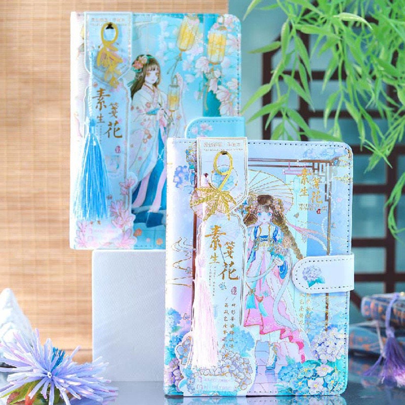 Ancient Asian Beauty Leather Journal with Magnetic Buckle in Kawaii Style, featuring intricate pastel illustrations of Asian women, lantern designs, and blue tassel charms.