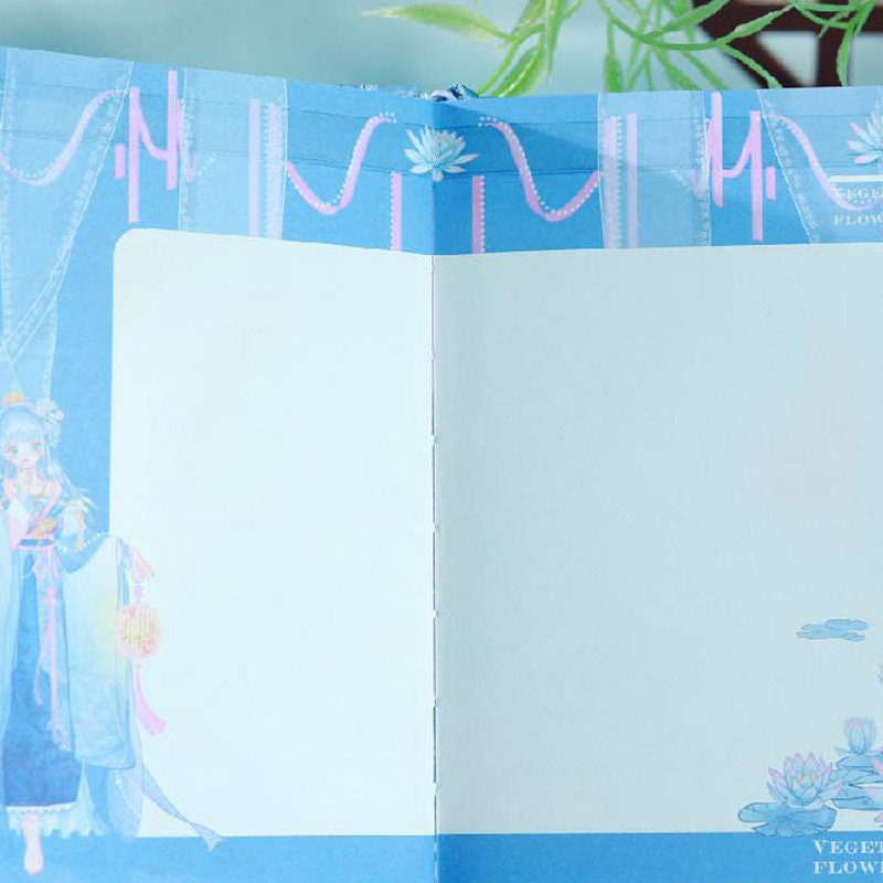 Ancient Asian Beauty Leather Journal with Magnetic Buckle - Open pages showcasing intricate blue-themed Asian artwork, perfect for writing and sketching.