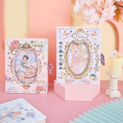 Dream Concerto Hard Cover Journal with Locker - A6 featuring elegant illustrations and vibrant pastel colors displayed on a pink surface with decorative flowers and candles in the background.