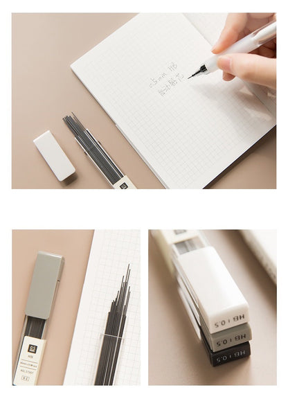 0.5mm mechanical pencil refill pack with 20 HB lead refills displayed on grid notebook, close-up of black, gray, and white containers.