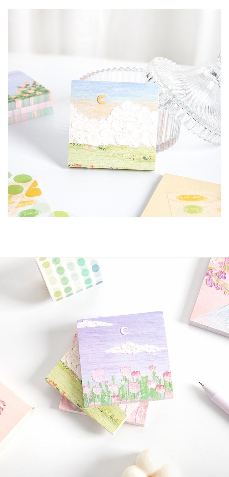 Flower Field Sticky Notes Set with 120 pieces, featuring whimsical floral designs and pastel skies, displayed on a white surface.