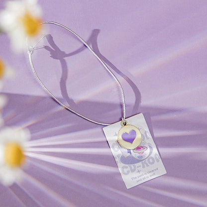 Emotional Palette A5 Notebook with Bookmark and 3D Pages featuring a purple heart charm bookmark on a lavender background with daisies.