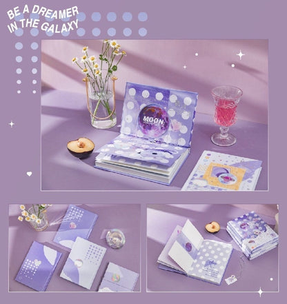 Emotional Palette A5 Notebook with Bookmark and 3D Pages in purple design, featuring a pop-up moon theme and playful polka dots, displayed on a lilac table with flowers.