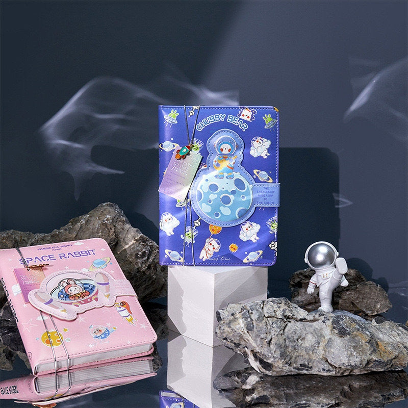 Spaceship Leather Journal with Bookmark featuring Magnetic Buckle in blue and pink kawaii designs, cute space and astronaut illustrations.