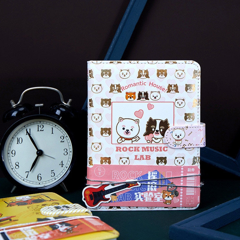 Rock Music Leather Journal with Magnetic Buckle and 224 Pages, featuring cute animal designs, heart patterns, and a small guitar motif, perfect for kawaii stationery collections.