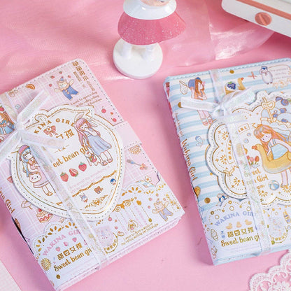 Magnetic Buckle Leather Journal - Sweet Bean Girl in kawaii style featuring adorable illustrations and pastel colors with decorative cards and white ribbons on a pink background.