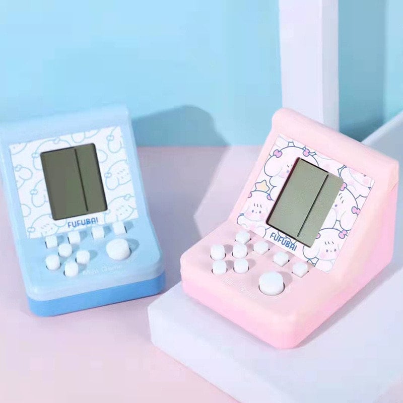 Blue and pink mini game players for kids with kawaii designs, featuring small screens and button controls, perfect for puzzle gaming.