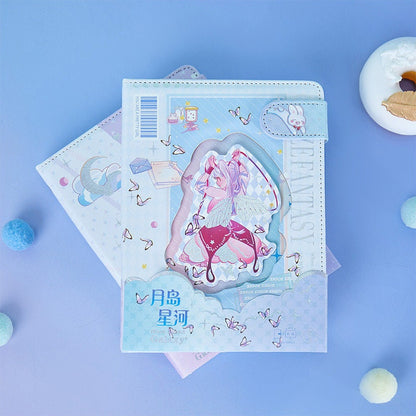 Pink Leather Galaxy Planner with Magnetic Buckle featuring a whimsical fairy design on a pastel blue background with colorful stationery items.