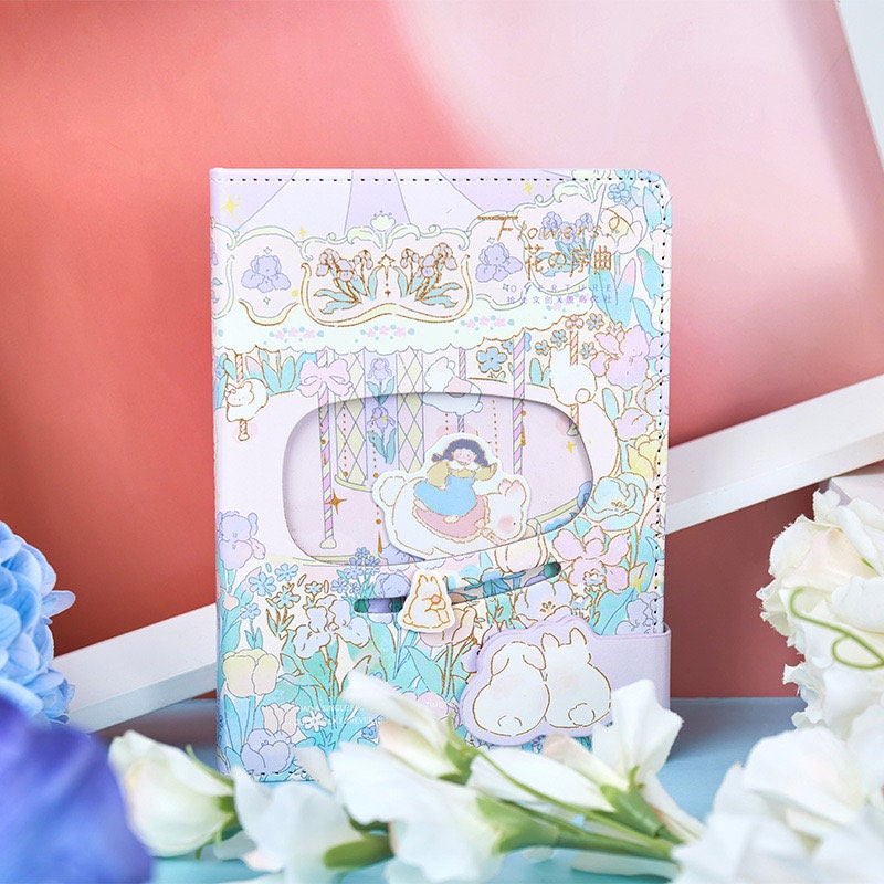 Flower Prelude Pink Leather Planner with Magnetic Buckle featuring whimsical floral and character illustrations in pastel colors. Kawaii stationery for organization and journaling.