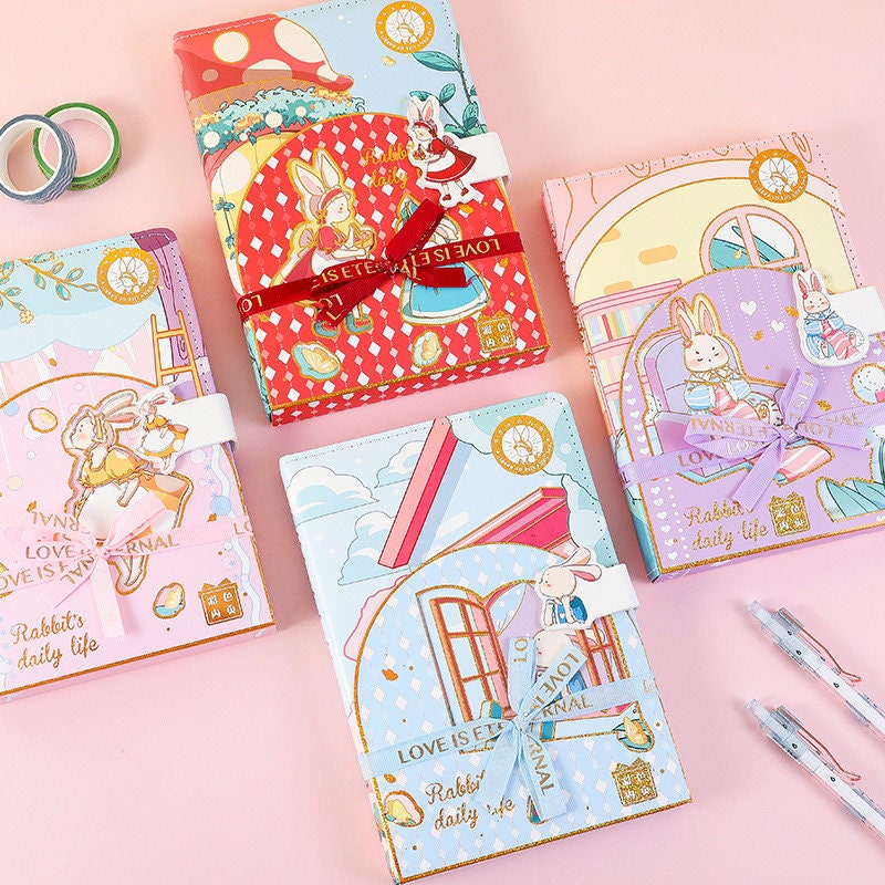 Rabbit's Daily Life Leather Journal with Magnetic Buckle in Kawaii Style, featuring cute illustrated rabbit characters, colorful designs, and pastel backgrounds. Perfect for notes, sketches, and personal journaling.